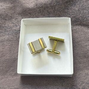Gold and silver tone stainless steel cuff links. Excellent condition!